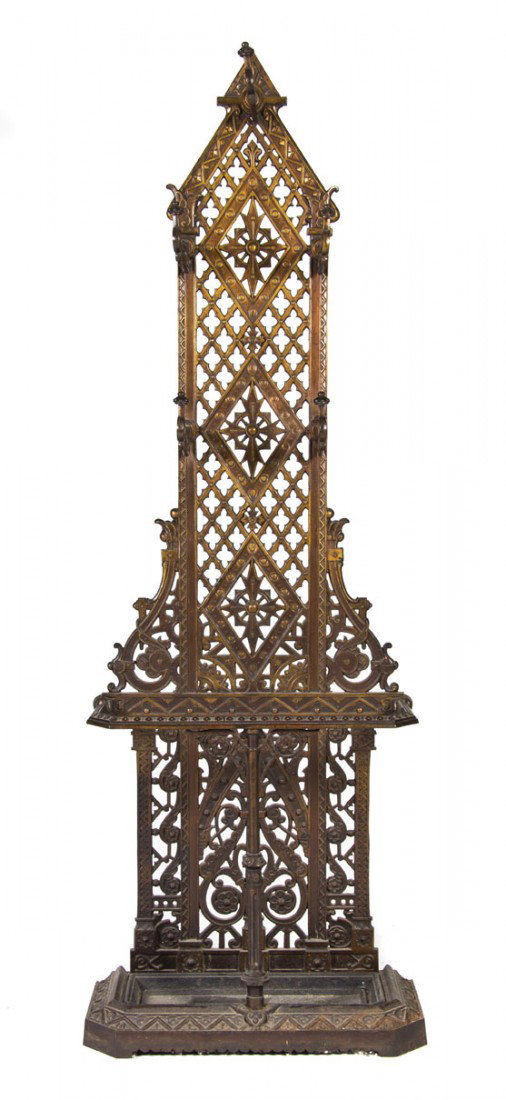 An Aesthetic Style Cast Iron Hall Tree, Height 74 : An Aesthetic Style Cast Iron Hall Tree, having a pointed crest and five hooks with pierced geometric decoration throughout. Height 74 1/2 x width 25 1/2 x depth 11 1/2 inches.