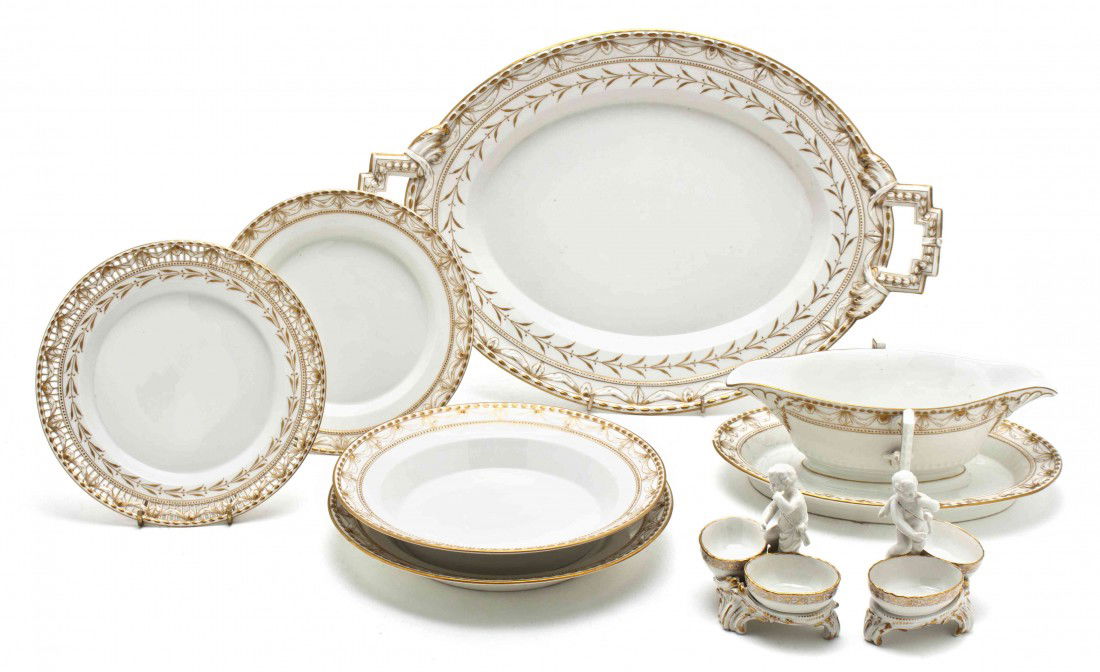 A Berlin (K.P.M.) Partial Porcelain Table Service,: A Berlin (K.P.M.) Partial Porcelain Table Service, having gilt decoration, comprising a covered tureen, two circular trays, three oval platters, three sauces with attached under plates, a center bowl,