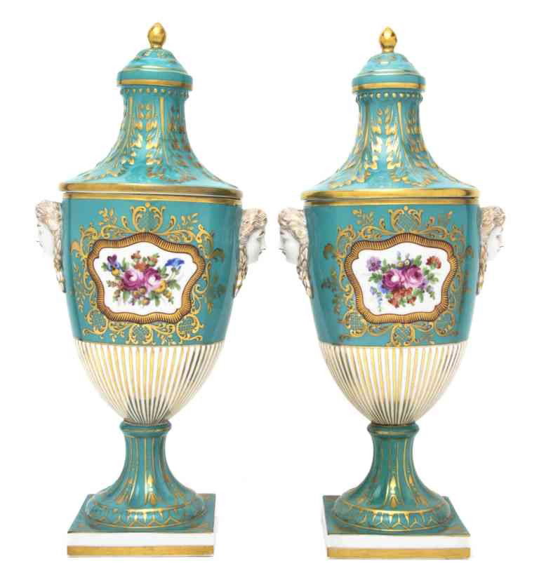 A Pair of Dresden Porcelain Lidded Urns, Carl Thie: A Pair of Dresden Porcelain Lidded Urns, Carl Thieme, the lids decorated with acanthus leaves, the bodies with floral sprays and female masks. Height 15 1/8 inches.