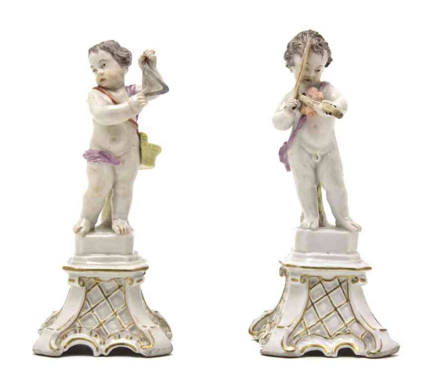A Pair of German Porcelain Figures, Ludwigsburg, H: A Pair of German Porcelain Figures, Ludwigsburg, each depicting a musical putto, one with a violin, the other a triangle, raised on gilt decorated pedestal bases, each having crowned mark. Height of t