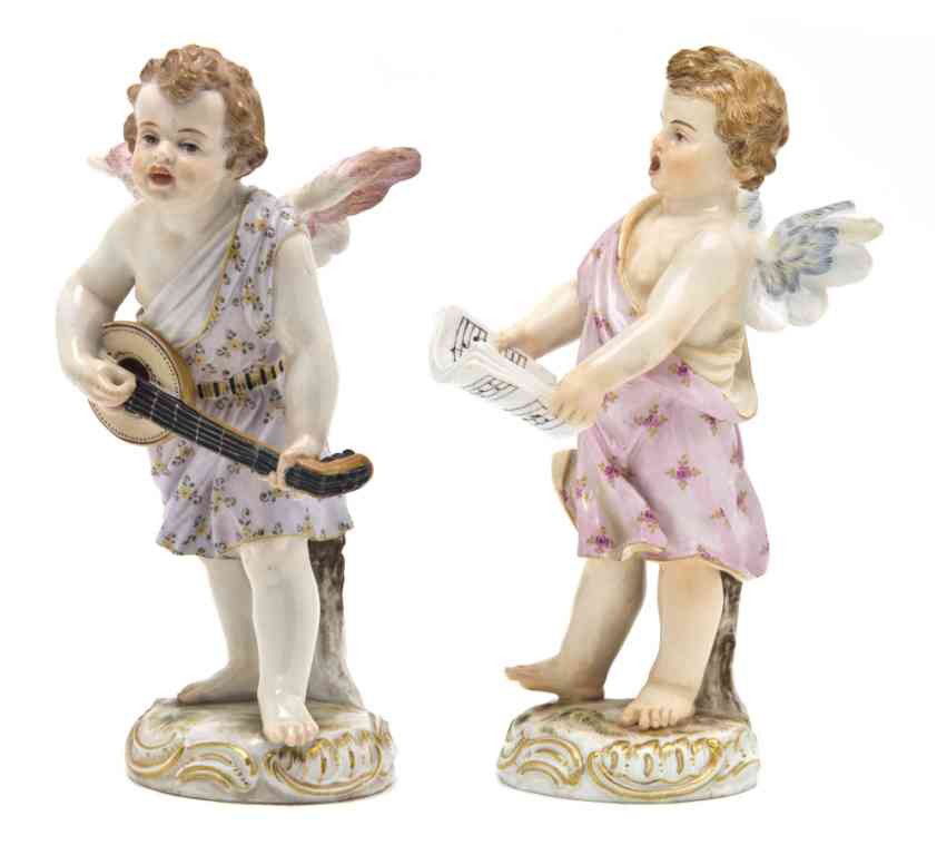 Two Meissen Porcelain Figures, Height of first 6 3: Two Meissen Porcelain Figures, the first depicting a standing cherub playing the lute, having crossed swords mark in underglaze blue, impressed 6. and incised O.193, the second depicting a cherub sing