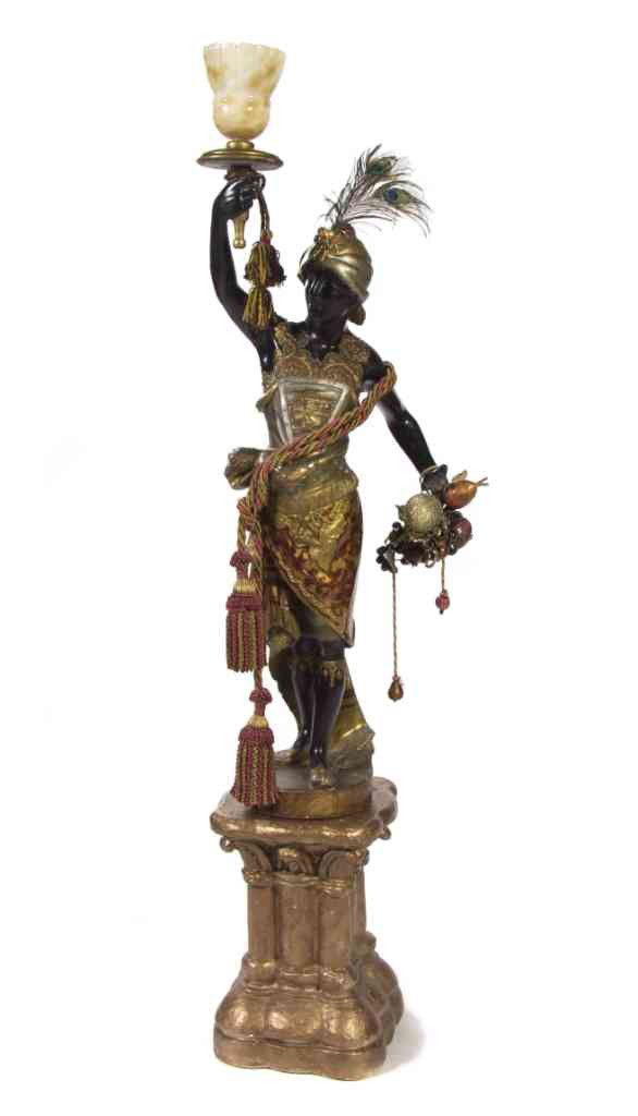 A Venetian Painted and Parcel Gilt Blackamoor Torc: A Venetian Painted and Parcel Gilt Blackamoor Torchiere, the figure depicted standing and supporting the torch with an alabaster shade, set on a carved wood pedestal. Height overall 72 1/2 inches.