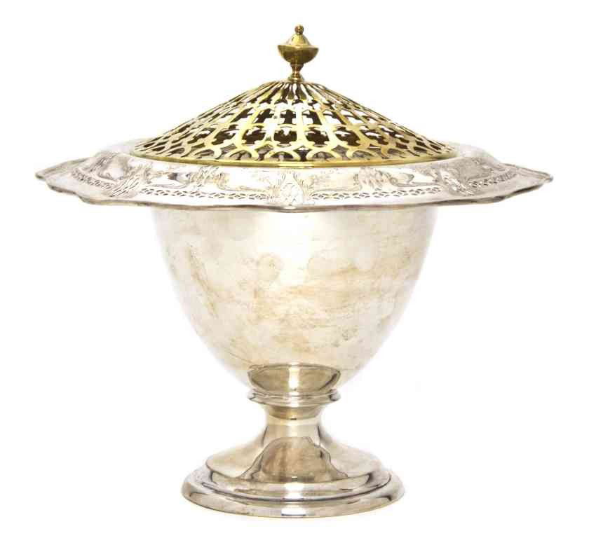 An American Sterling Silver Centerpiece Footed Bow: An American Sterling Silver Centerpiece Footed Bowl, Frank M. Whiting & Co., having an incised and pierced, foliate designed rim and inset pierced gilt metal lid, the ovoid form body supported by a st
