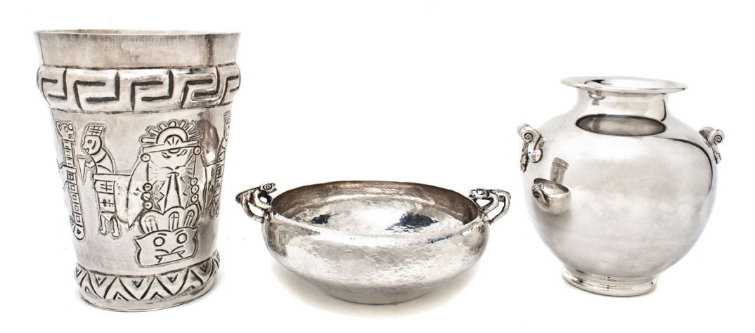 Three Peruvian Silver Articles, Height of tallest : Three Peruvian Silver Articles, comprising a vase of circular form with Incan figural decoration, a vase of baluster form with stylized foliate handles and a bowl of circular form with a hand hammered