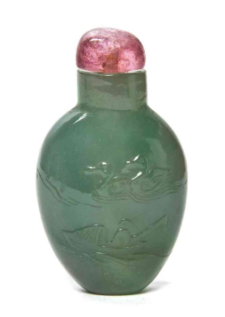 A Green Jadeite Snuff Bottle, Height 2 inches.: A Green Jadeite Snuff Bottle, of compressed ovoid form, carved with a duck and fisherman, on the other side a figure standing on a porch. Height 2 inches. Property from the Estate of Dr. Joseph and Do