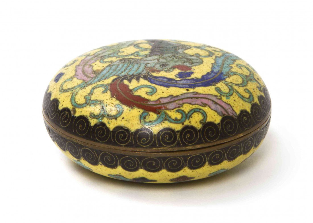 A Chinese Cloisonne Paste Box, Diameter 2 3/8 inch: A Chinese Cloisonne Paste Box, the lid decorated with a phoenix on a yellow reserve. Diameter 2 3/8 inches. Property of a Private Collection, Detroit, Michigan and Chicago, Illinois