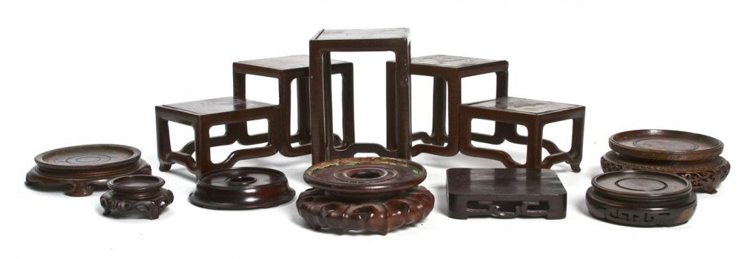 A Group of Chinese Hardwood Stands, Width of wides: A Group of Chinese Hardwood Stands, comprised of three stepped and square stands, the others of circular form. Width of widest 7 inches. Property from the Estate of Dr. Joseph and Donna Lee Boggs, Chi