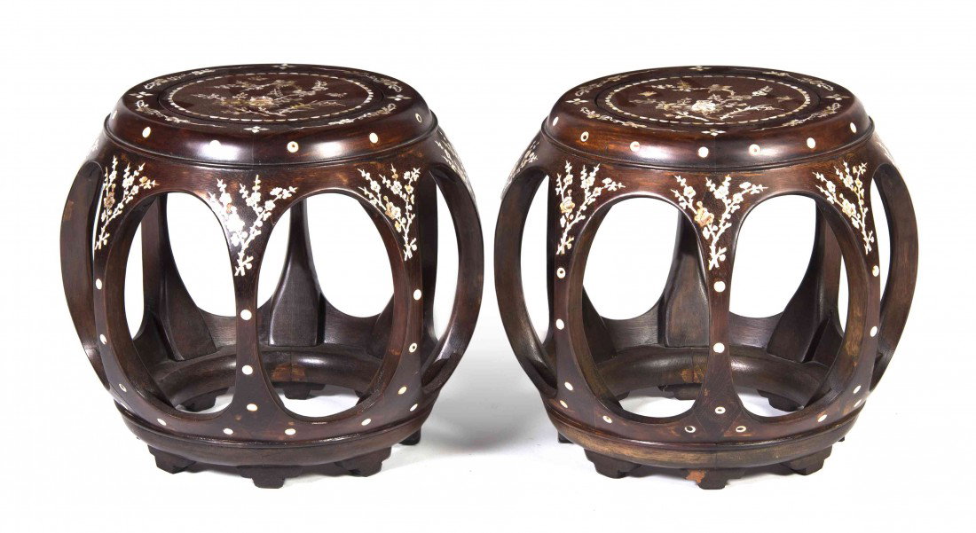 A Pair of Chinese Hardwood Garden Stools, Height 1: A Pair of Chinese Hardwood Garden Stools, of drum form having mother-of-pearl inlay throughout depicting foliate decoration and birds. Height 13 inches. Property from the Estate of Mr. Robert Sun, Chi