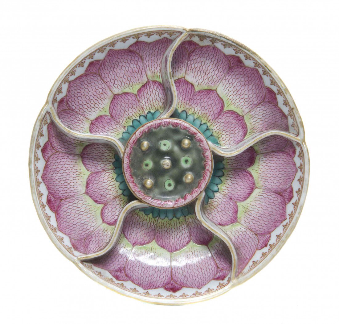 A Chinese Export Segmented Porcelain Dish, Diamete: A Chinese Export Segmented Porcelain Dish, having enameled decoration of a lotus flower with free moving seed pods at the center, possibly Chinese export for the Southeast Asian market. Diameter 5 1/2