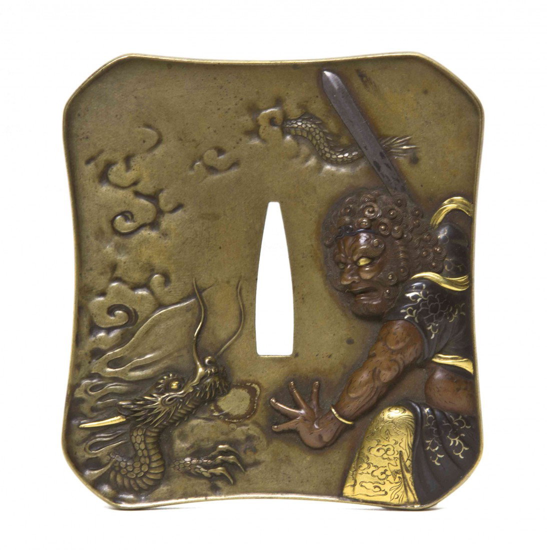 A Rectangular Bronze Tsuba, Height 3 1/4 inches: A Rectangular Bronze Tsuba, rendered in high relief, depicting a figure with a sword attacking a sinuous dragon, the reverse showing two figures hiding behind a pine tree, with four character mark. He