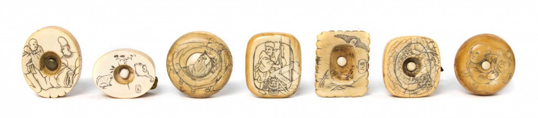 A Collection of Seven Ivory Manju-Netsuke, Width o: A Collection of Seven Ivory Manju-Netsuke, each having light carving of various subjects including a samurai and maiden playing a game, signed, a man drawing water from a well, signed, two buddhist pr
