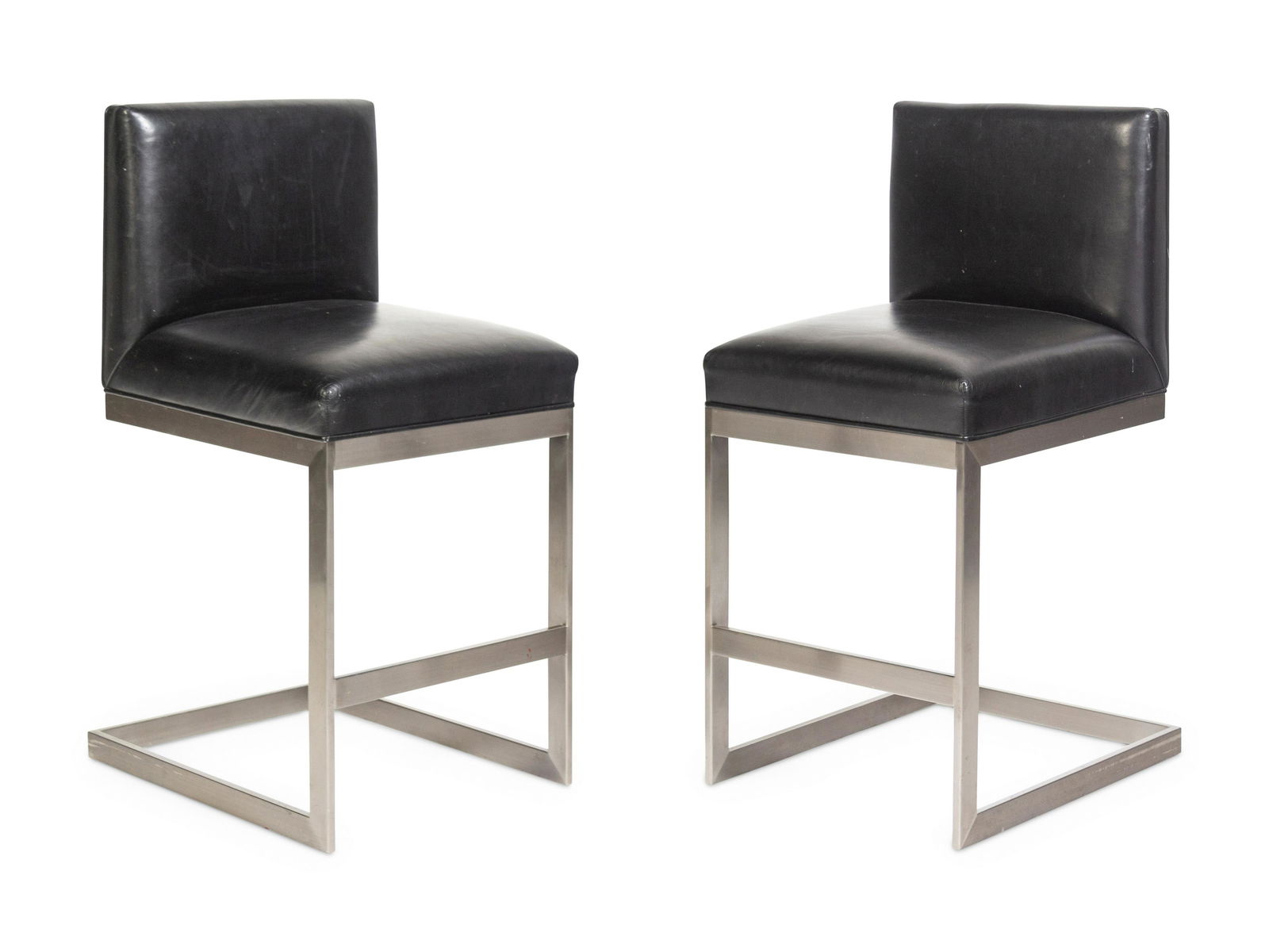 Brueton American, 20th Century Pair of HS Bar Stools, c. 1990: Brueton American, 20th Century Pair of HS Bar Stools, c. 1990 brushed steel, leather manufacturer's label to underside H 35 1/4 x W 16 x D 18 1/2 inches.