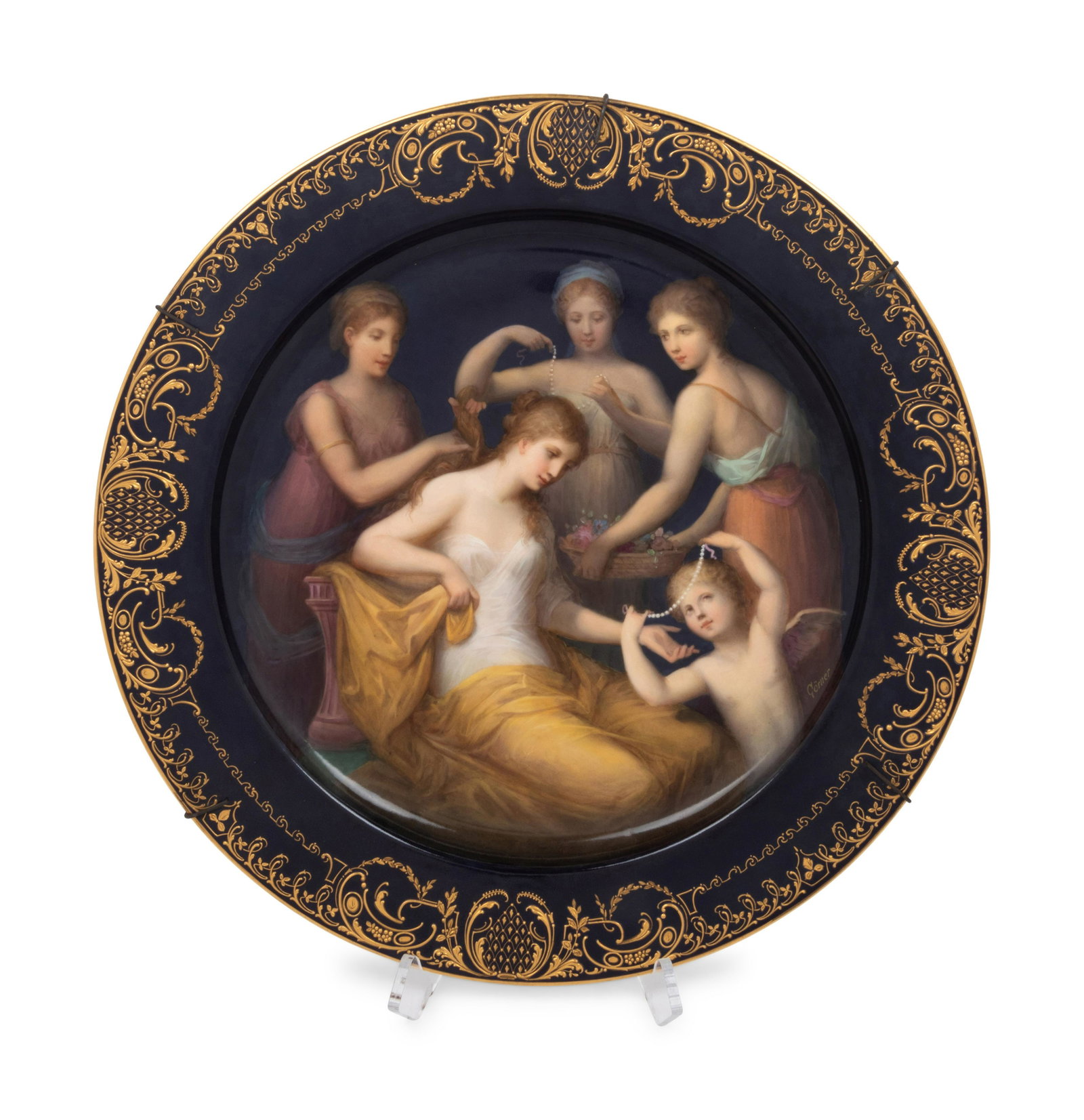 A Vienna Porcelain Charger: A Vienna Porcelain Charger Early 20th Century depicting The Adornment of Venus (Schma¼ckung der Venus), the painted scene signed Gorner, bearing a beehive mark and titled to the reverse. Diameter