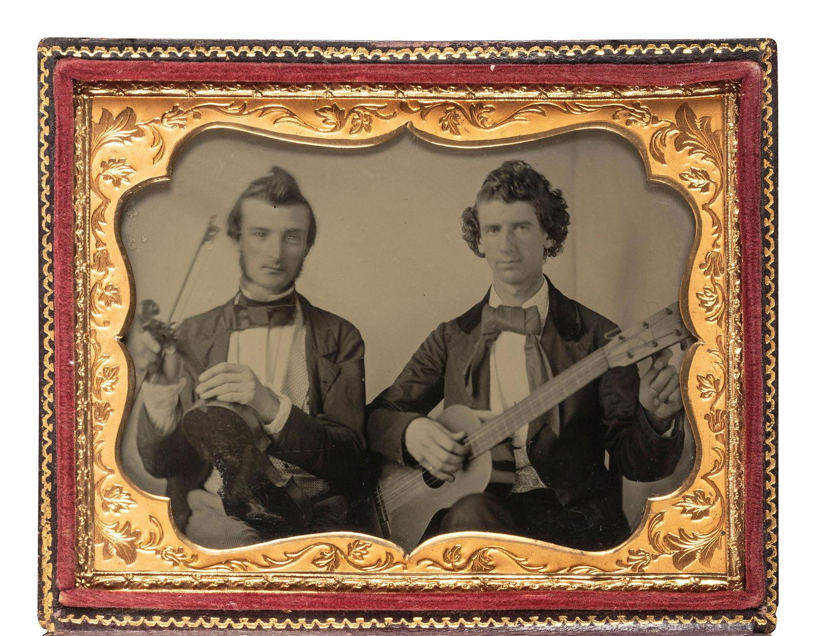 [EARLY PHOTOGRAPHY]. Quarter plate ambrotype portrait of two musicians, tentatively identified.  (1 of 2)