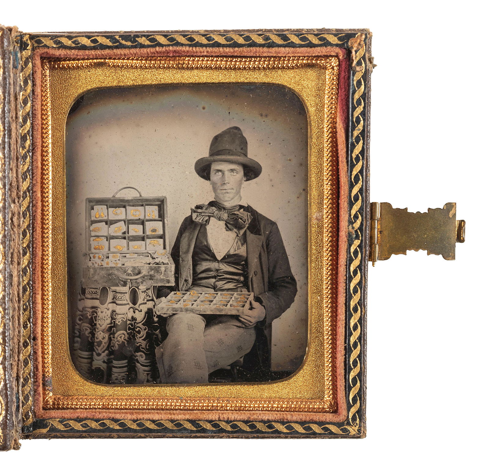 [EARLY PHOTOGRAPHY]. Sixth plate ambrotype featuring a jewelry salesman displaying his wares.  (1 of 2)