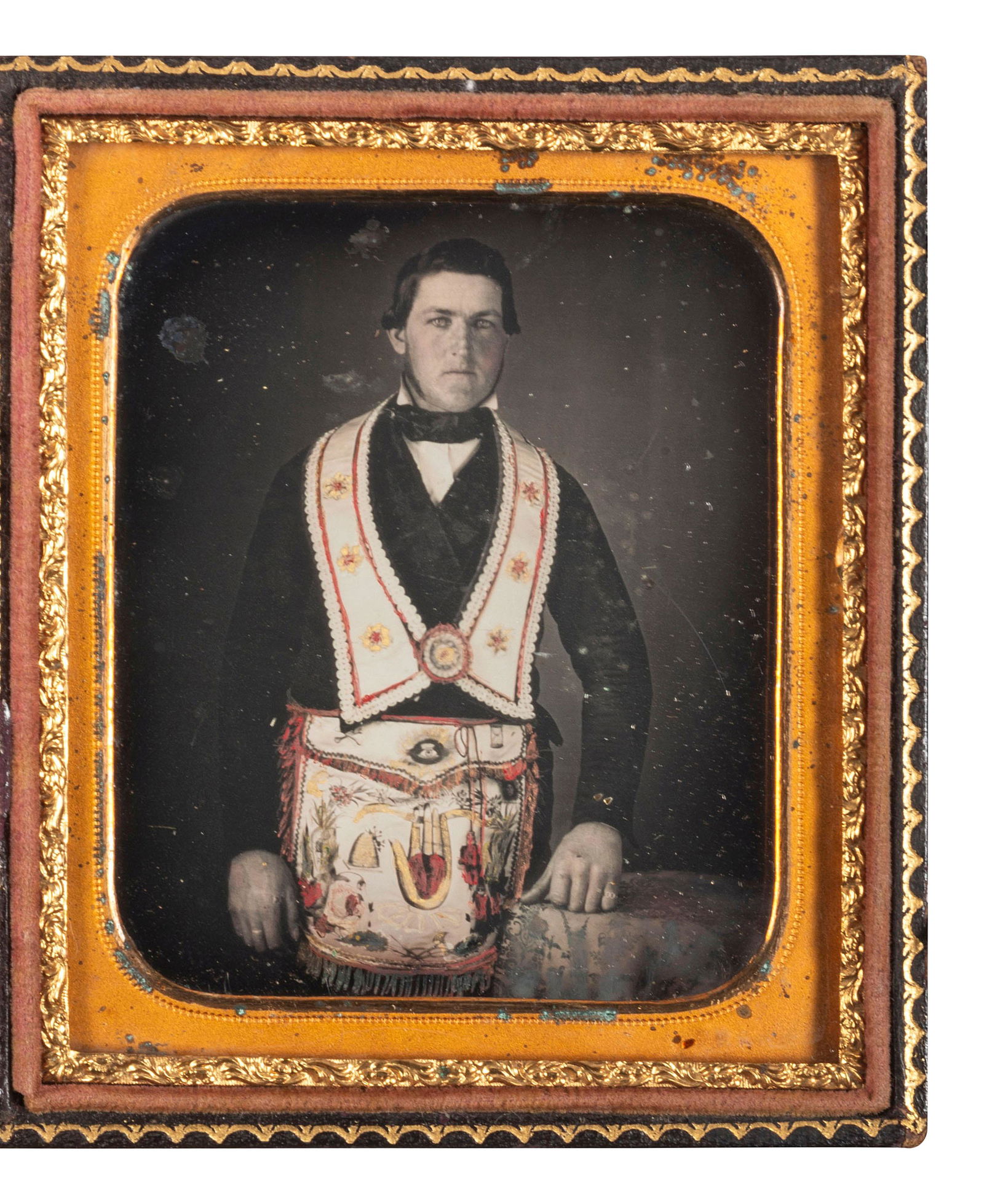 [EARLY PHOTOGRAPHY]. Sixth plate daguerreotype of an Odd Fellow in regalia featuring fine hand (1 of 2)