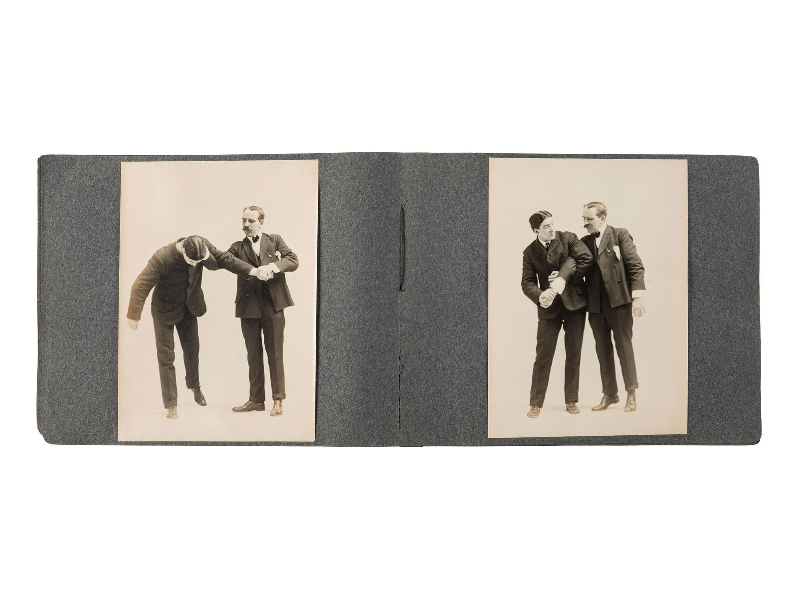 [EARLY PHOTOGRAPHY]. Album containing 72 photographs of self-defense maneuvers. Ca 1895. (1 of 5)