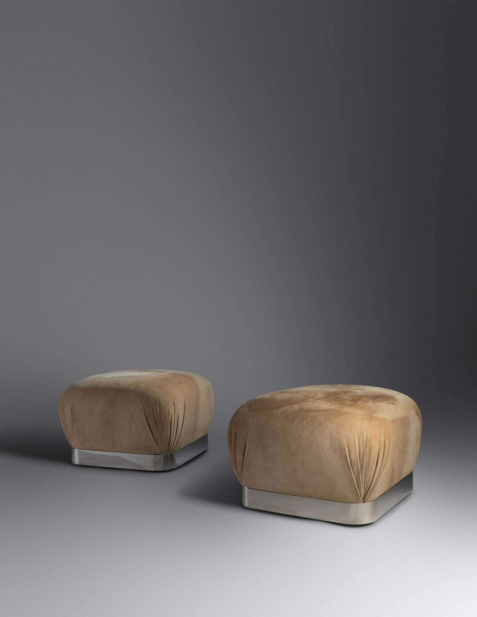 Karl Springer (1931-1991)  A Pair of Souffle Ottomans/Poufs, together with an unattributed footstool (1 of 2)