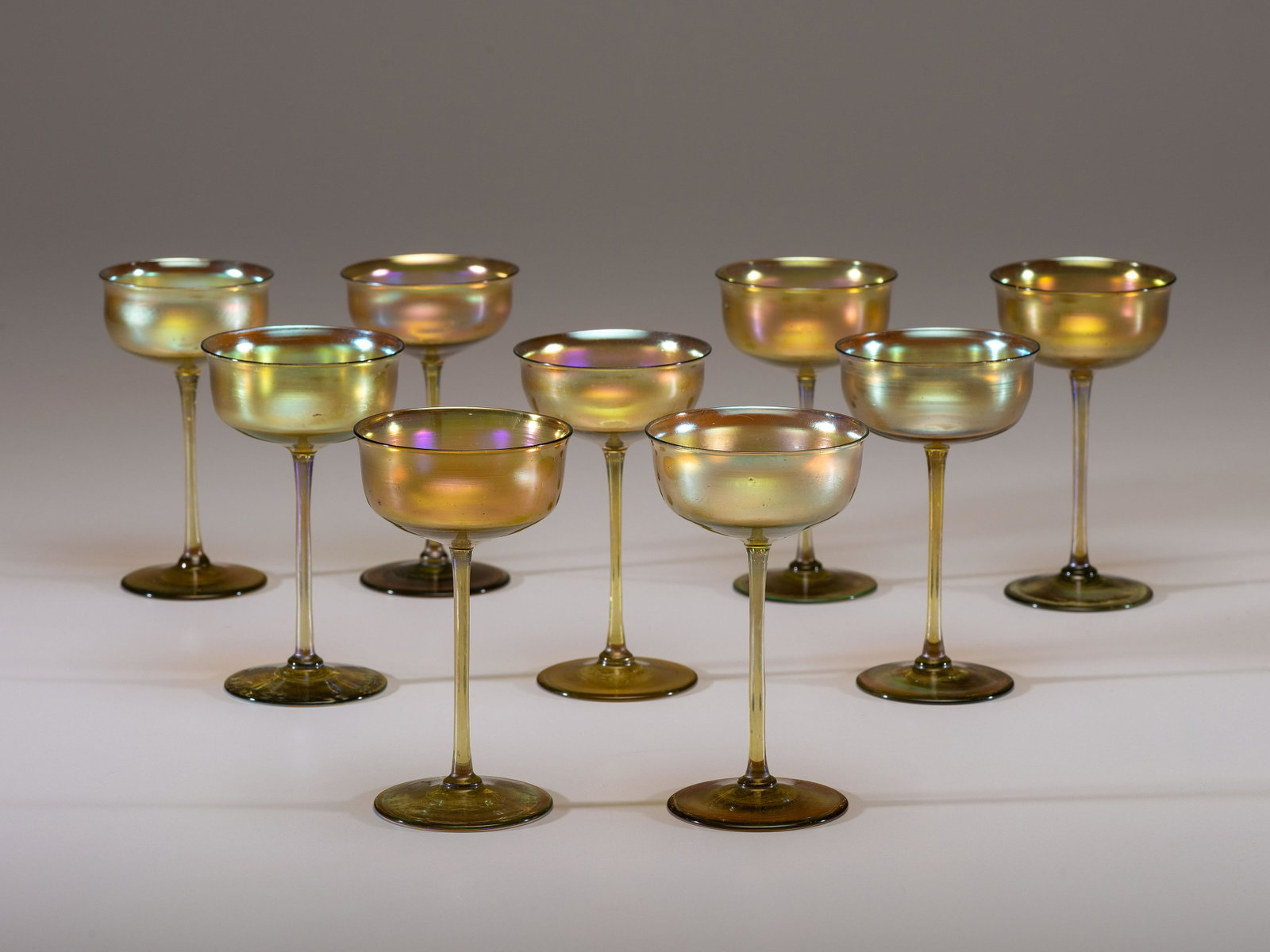 Tiffany Studios American, Early 20th Century Nine Wine Glasses: Tiffany Studios American, Early 20th Century Nine Wine Glasses favrile glass unmarked H 6 inches. Property from the Collection of Dr. Kianoosh Jafari