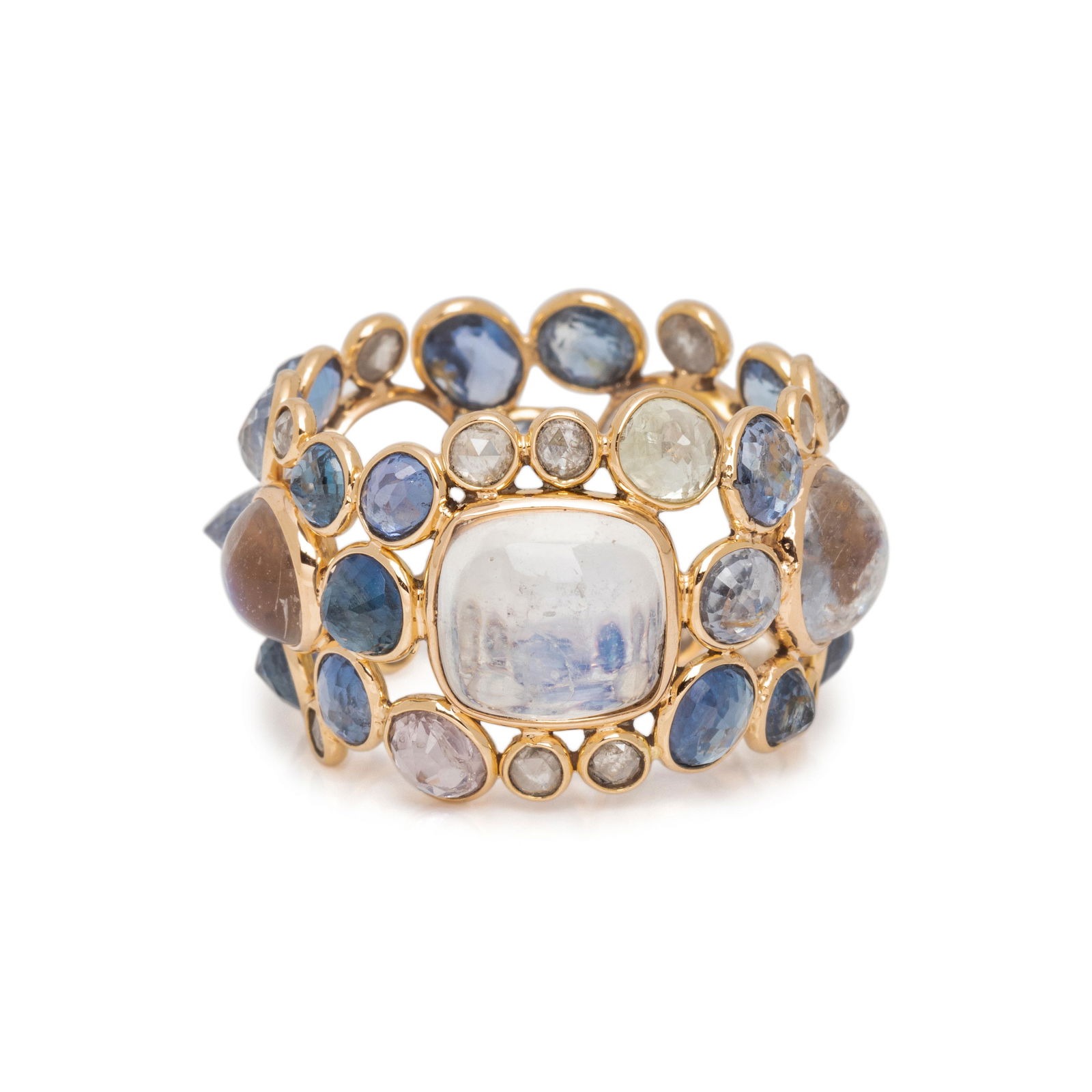 MOONSTONE, SAPPHIRE AND DIAMOND BAND: MOONSTONE, SAPPHIRE AND DIAMOND BAND Containing five round and cushion cabochon moonstones, numerous round and mixed cut sapphires in various colors and 12 rose cut diamonds. Mounted in rose gold. Rin