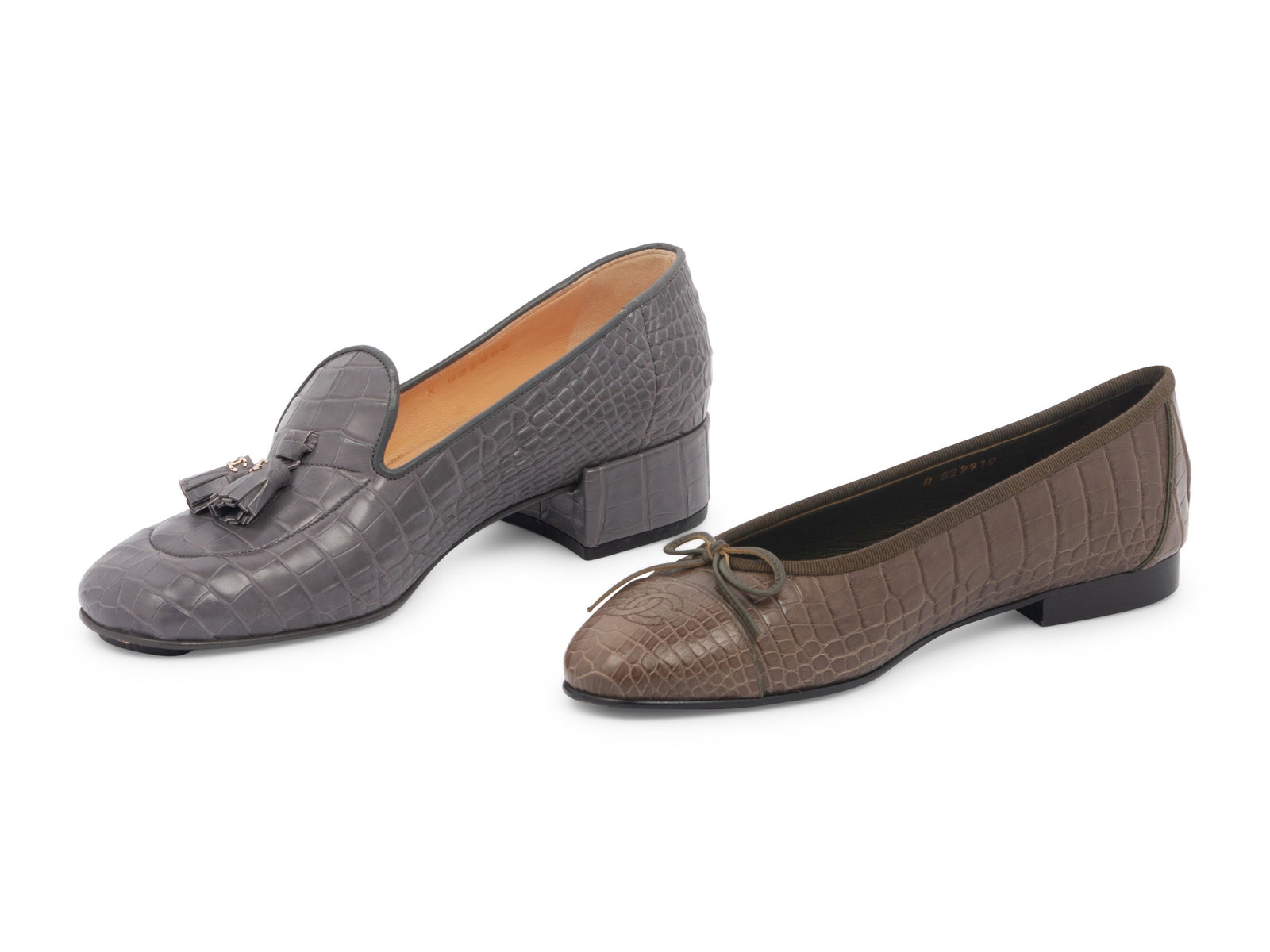 Two Pairs of Chanel Exotic Skin Shoes: Two Pairs of Chanel Exotic Skin Shoes This lot contains two pairs of shoes. THE FIRST Grey alligator 'Mocassin Loafers' with a broad square toe and tassels on the vamp with silver-tone interloc