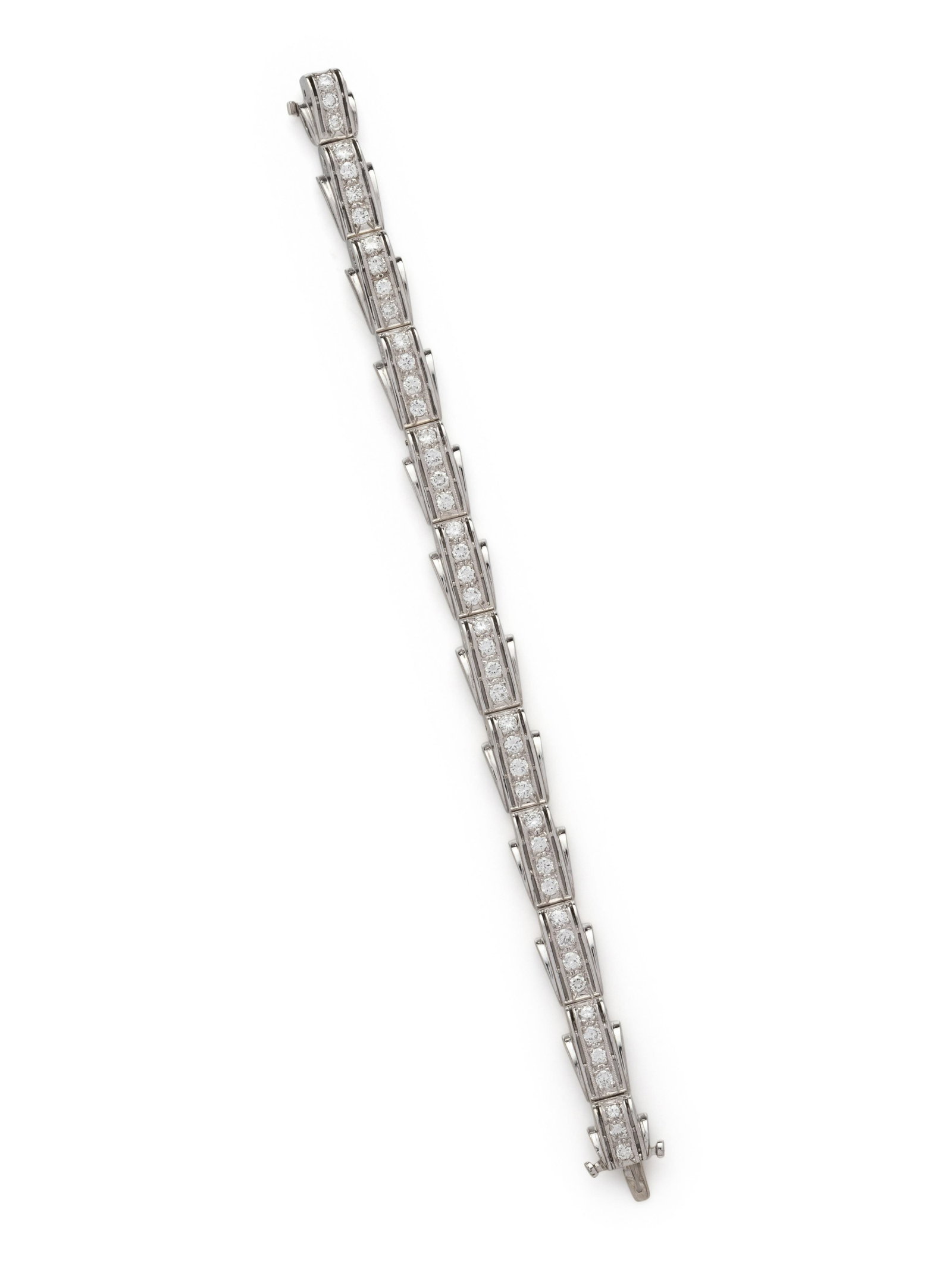 WHITE GOLD AND DIAMOND BRACELET: WHITE GOLD AND DIAMOND BRACELET Containing 46 round brilliant cut diamonds weighing approximately 3.45 carats total. 6 1/2 inches long. Stamp: 14K. Gross weight: 14.80 dwt. Property from a South Flori