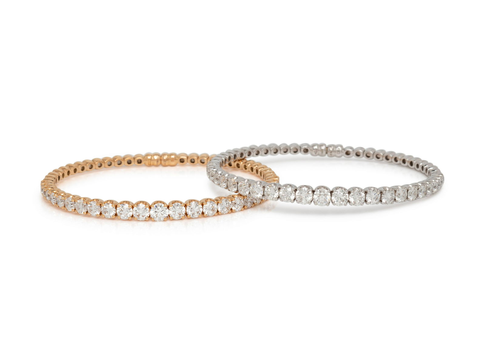 CRIVELLI, DIAMOND BRACELET SET: CRIVELLI, DIAMOND BRACELET SET Consisting of a rose gold bracelet containing 25 round brilliant cut diamonds weighing approximately 4.81 carats total, with magnetic clasp, together with a white gold b