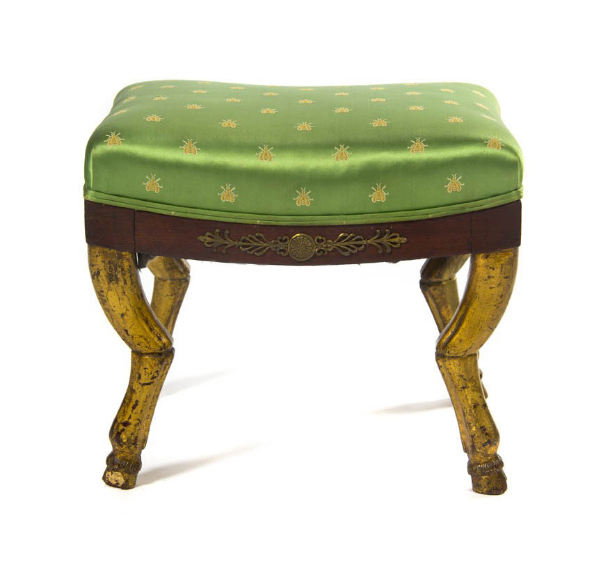 An Empire Mahogany, Parcel Gilt and Gilt Metal Mou: An Empire Mahogany, Parcel Gilt and Gilt Metal Mounted Tabouret, the rectangular upholstered top raised on four hoof form feet. Height 15 inches.