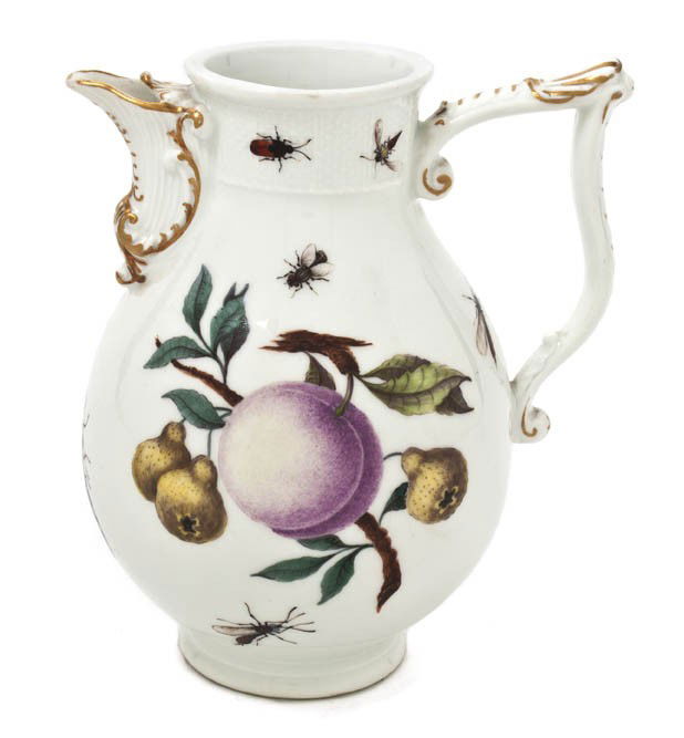 A Meissen Porcelain Milk Jug, Height 5 7/8 inches.: A Meissen Porcelain Milk Jug, decorated with fruit and insects, having crossed swords mark in underglazed blue. Height 5 7/8 inches.