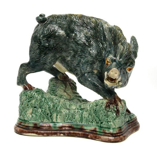 A Majolica Figural Group, Height 9 1/2 inches.: A Majolica Figural Group, depicting a boar on a naturalistic base, having an illegible impressed mark on base. Height 9 1/2 inches.