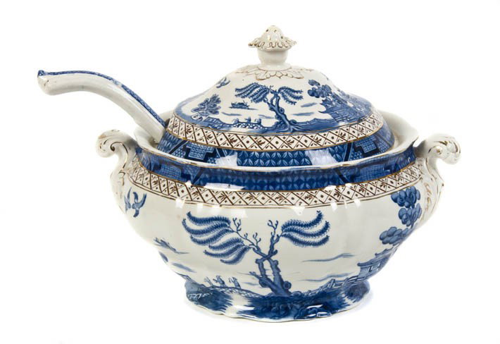 An English Transferware Soup Tureen, Booths, Width: An English Transferware Soup Tureen, Booths, having ladle and cover decorated with Chinoiserie scenes. Width over handles 12 1/4 inches.