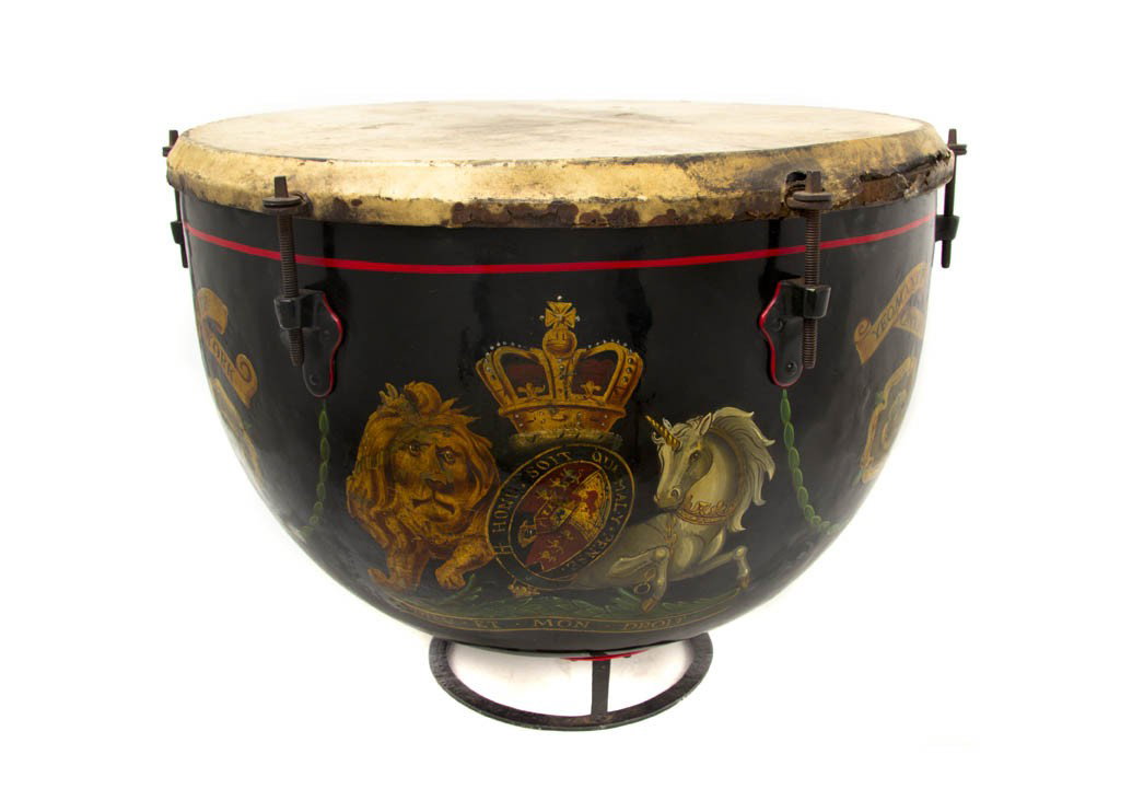 An English Tole Decorated and Hide Kettle Drum, Di: An English Tole Decorated and Hide Kettle Drum, centered with the royal crest of England, further marked for North York Yeoman cavalry, with mallet. Diameter 19 1/4 inches.