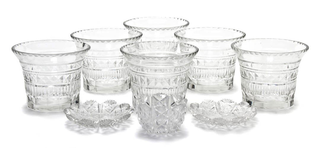 A Set of Six English Cut Glass Rinsers, Height of: A Set of Six English Cut Glass Rinsers, each of flared form, together with two cut glass bowls and underplates. Height of set 3 7/8 inches.