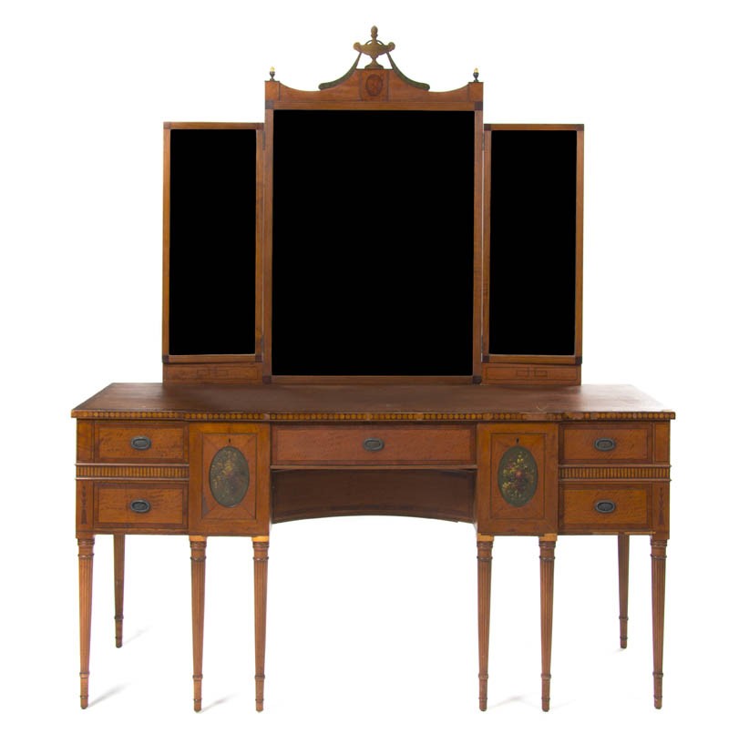 An Edwardian Satinwood Server, Height 30 1/2 x wid: An Edwardian Satinwood Server, having a three-panel mirror above the breakfront form top with banded edge over a central drawer flanked by additional drawers, raised on fluted tapering legs. Height 30