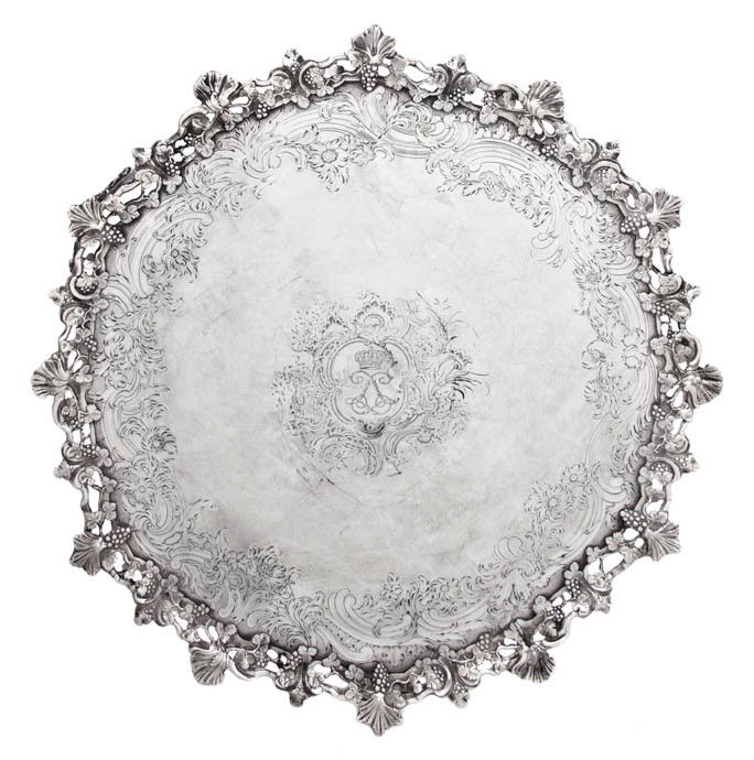 An English Silver Salver, John Jacob, Diameter 14: An English Silver Salver, John Jacob, London, 18th century, having open grapevine border, centered with engraved crest having crowned interlaced Ls, raised on three conforming grapevine feet; approxim