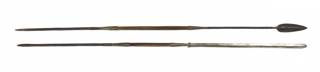 A Collection of Two Iron and Wood Spears, Length o: A Collection of Two Iron and Wood Spears, one having spade form head above twisted shaft, the other with long blade, both having pointed ends. Length of first 68 1/4 inches.