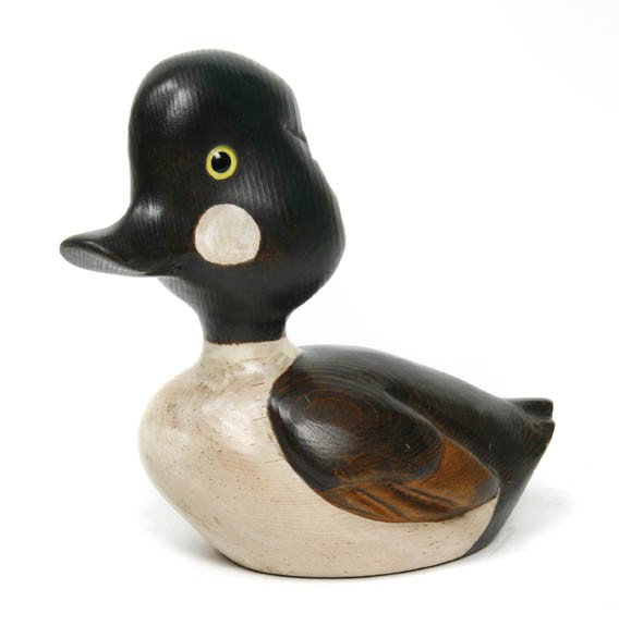 A Carved Wood and Polychrome Painted Caricature of: A Carved Wood and Polychrome Painted Caricature of a Decoy, Bob Hayden, depicting a Common Goldeneye with glass eyes, signed Bob Hayden. Length 9 1/2 inches.