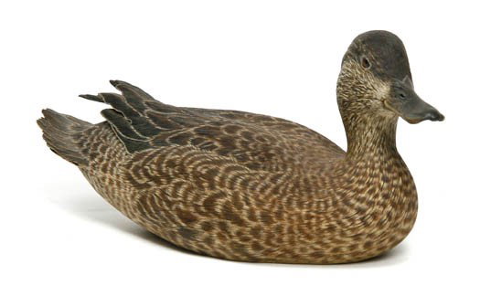 A Carved Wood and Polychrome Painted Decoy, Chuck : A Carved Wood and Polychrome Painted Decoy, Chuck Gear, depicting a Blue-Winged Teal hen, signed Chuck Gear and dated 3/86. Length 11 inches.