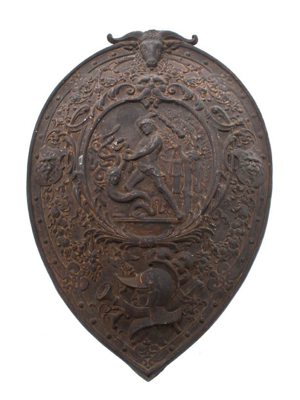 A Neoclassical Cast Iron Shield Form Plaque, Heigh: A Neoclassical Cast Iron Shield Form Plaque, depicting Hercules slaying the Hydra. Height 16 3/4 inches.