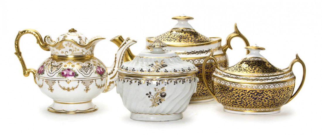 A Group of Four English Table Articles, Length of: A Group of Four English Table Articles, comprising a partial tea service including a teapot and covered sugar, a Cauldon teapot and a covered sugar. Length of longest 10 1/2 inches.