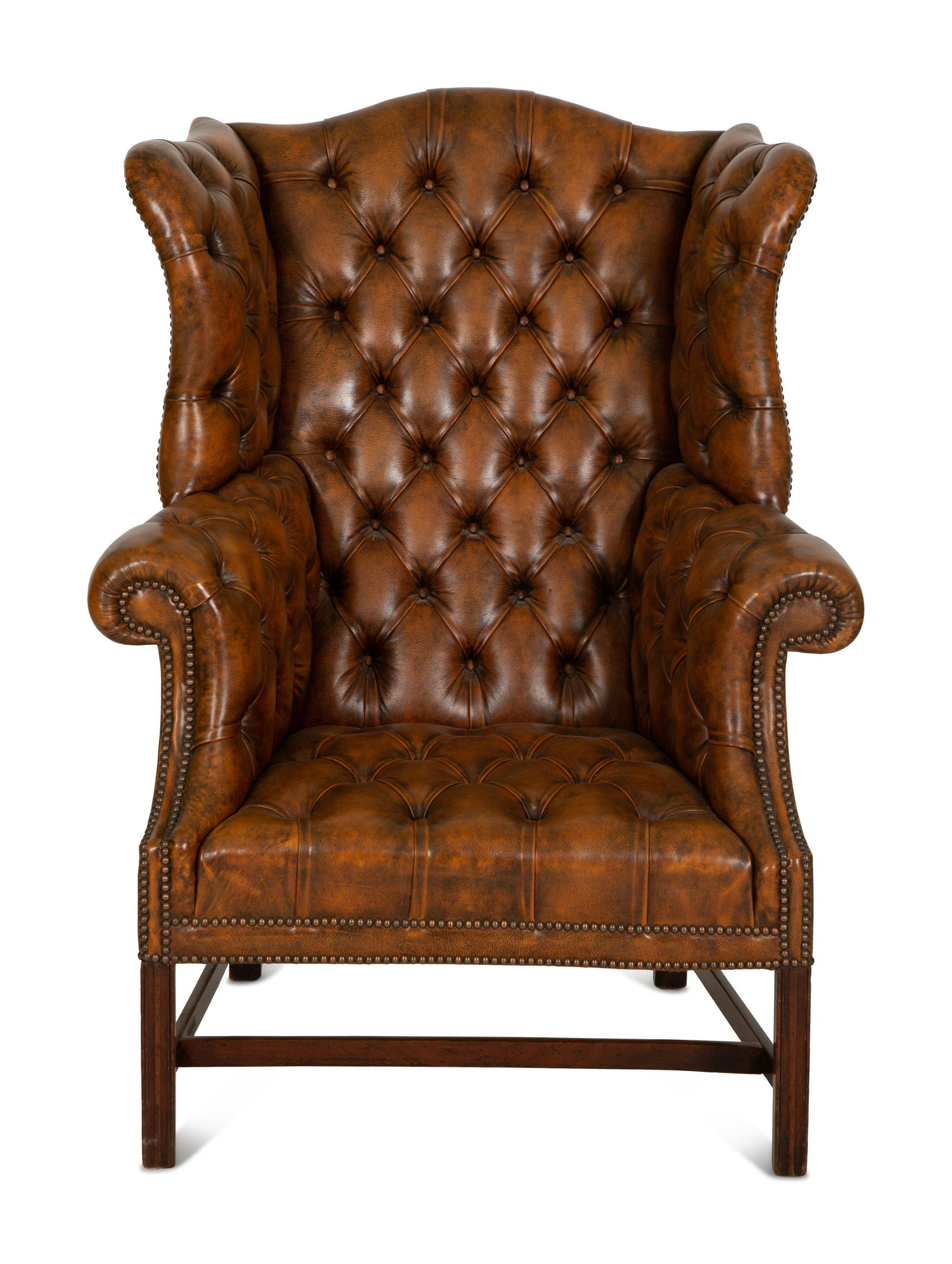 An English Leather-Upholstered Wingback Armchair: An English Leather-Upholstered Wingback Armchair 20th Century Height 47 x width 35 x depth 29 inches.Seat height 16 1/2 inches. Property of David and Jillian Gilmour, Palm Beach, Florida