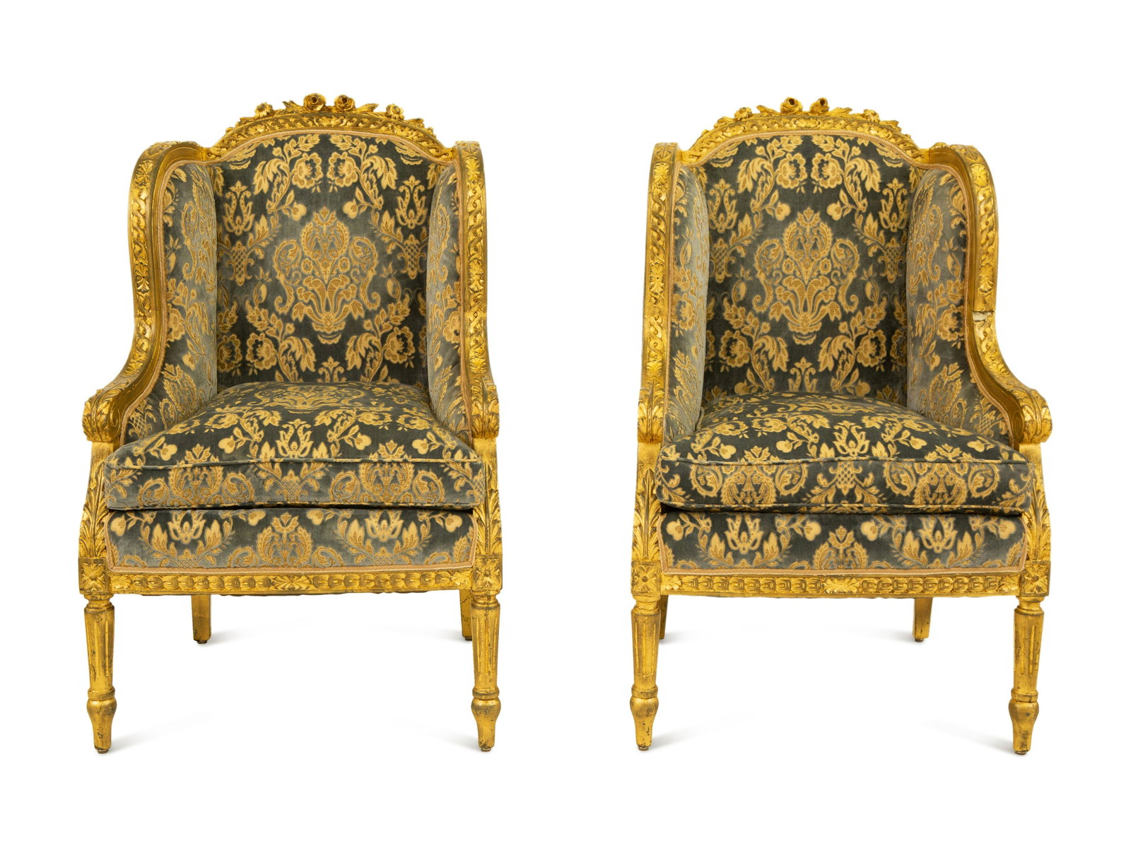 A Pair of Louis XVI Style Giltwood Bergeres a Oreilles: A Pair of Louis XVI Style Giltwood Bergeres a Oreilles 19th Century each raised on fluted tapering legs; with cut velvet upholstery.Height 45 1/2 x width 20 x depth 26 inches.