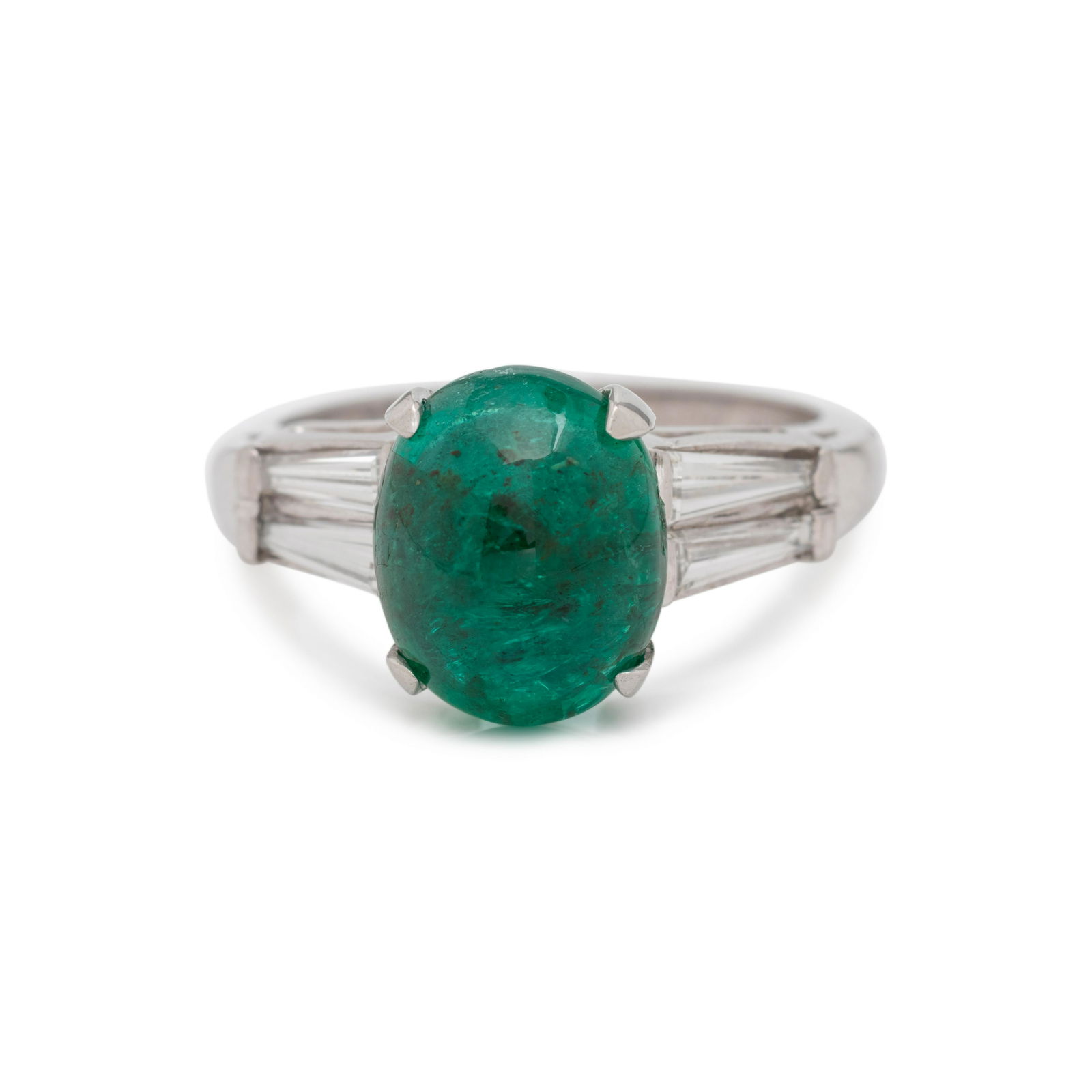 EMERALD AND DIAMOND RING: EMERALD AND DIAMOND RING Containing one oval cabochon emerald measuring approximately 10.65 x 8.60 x 6.20 mm and four tapered baguette cut diamonds weighing approximately 0.35 carat total. Mounted in