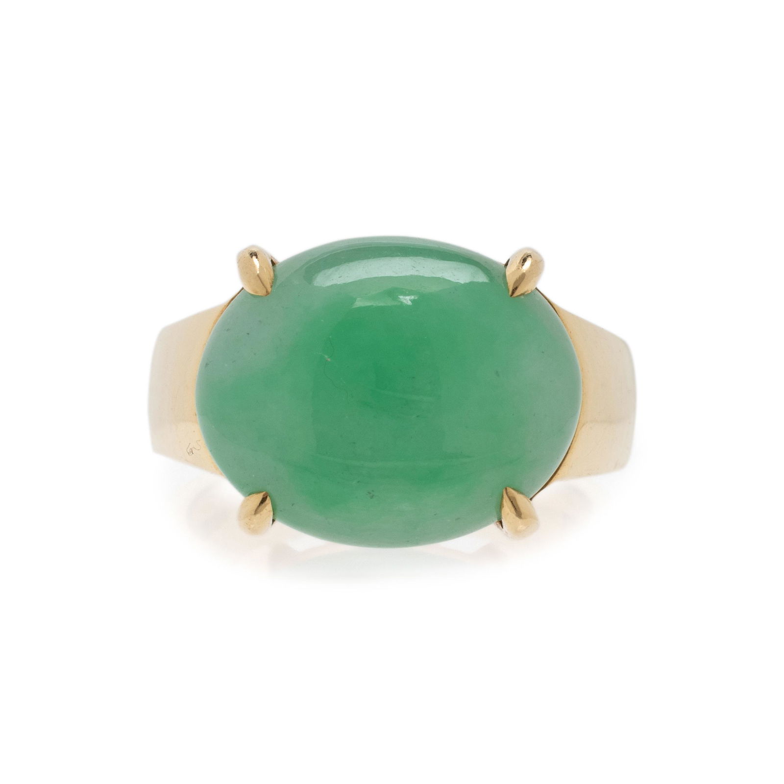 GUMP'S, YELLOW GOLD AND JADE RING: GUMP'S, YELLOW GOLD AND JADE RING Containing one oval jade cabochon measuring approximately 14.95 x 12.10 x 5.75 mm. Ring size 5.Stamp: GUMP'S 18K.Gross weight: 6.95 dwt. Property from a South Florida