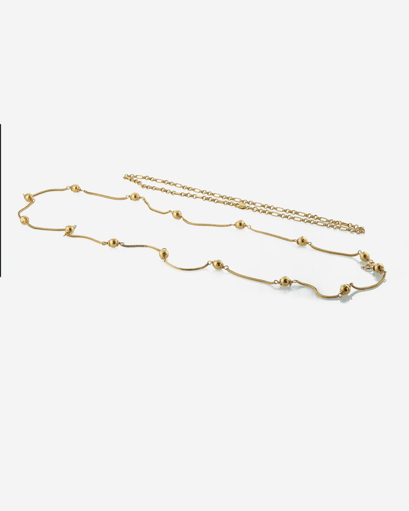 Set of Two 14K Yellow Gold Chains: Set of Two 14K Yellow Gold Chains Two yellow gold chains, one 14K double-link chain made in Italy, and one 14K chain with baubles. (Weight: 16.1 Gross dwt.) Provenance Private collection, Margate