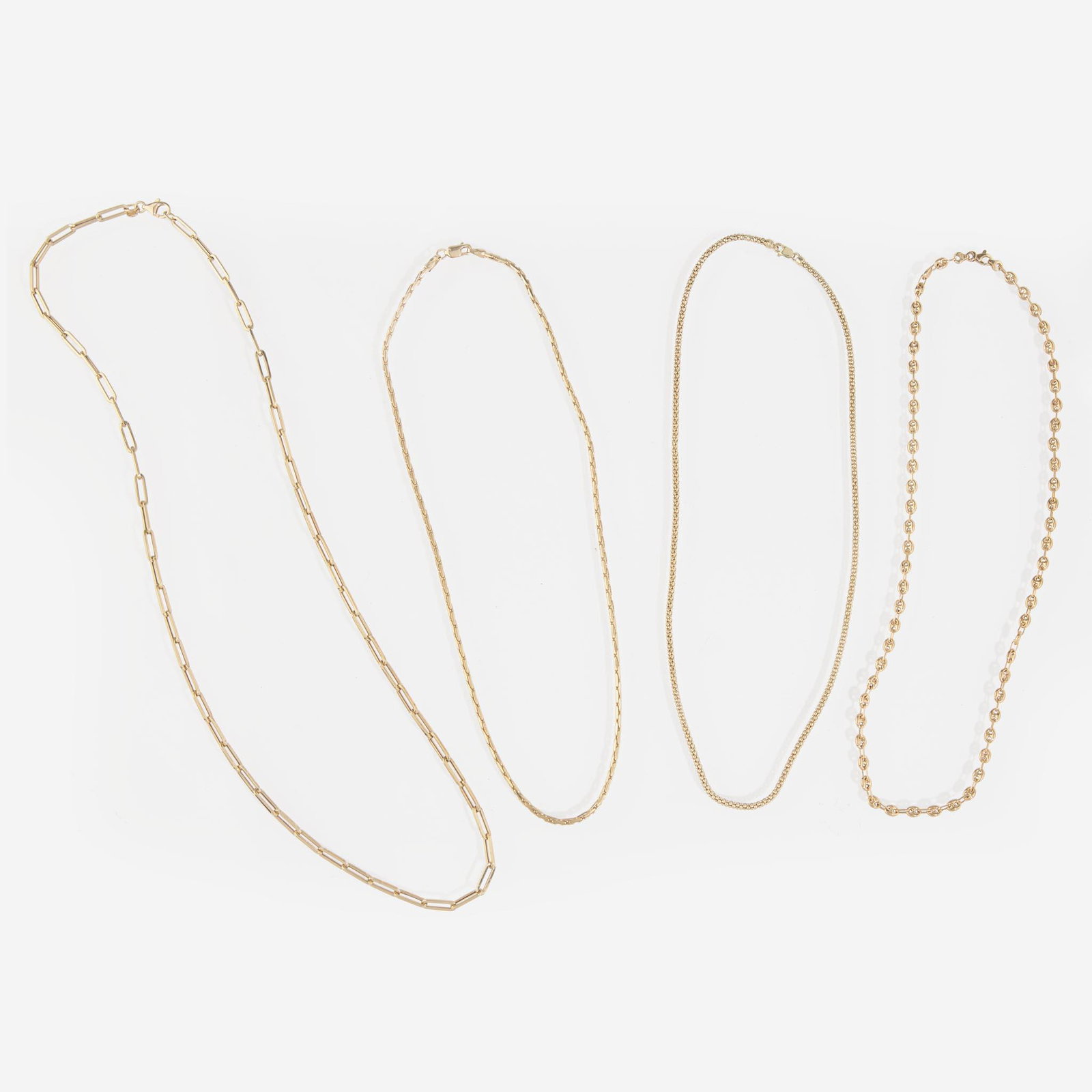 A Collection of Contemporary Yellow Gold Chains: A Collection of Contemporary Yellow Gold Chains A collection of four 14K yellow gold chains, including a popcorn link chain, an Italian-made fancy mariner link chain, an Italian-made paperclip link ch