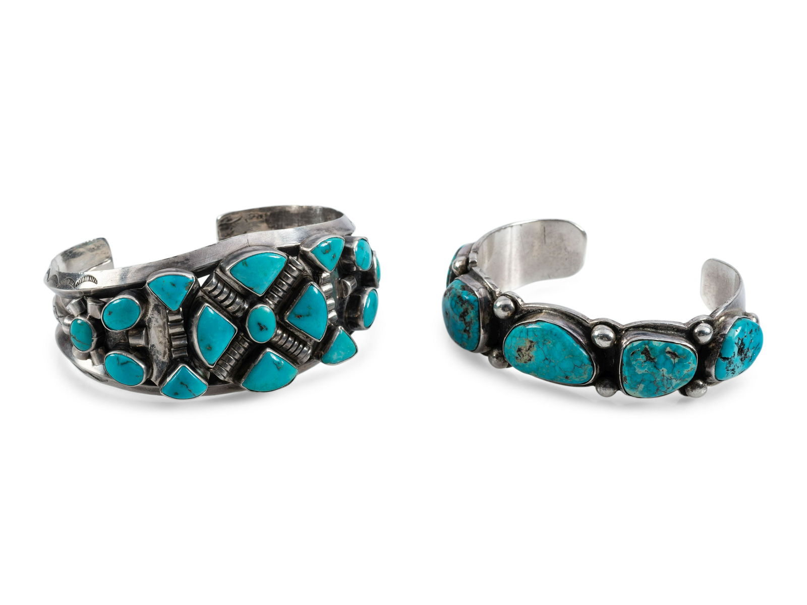 Pair of Navajo Silver and Turquoise Cuff Bracelets: Pair of Navajo Silver and Turquoise Cuff Bracelets third quarter 20th century lot of 2, neither marked, sizes include: cuff width 1-1/4 inches, interior circumference 5-1/2 inches x gap length 7/8 inc