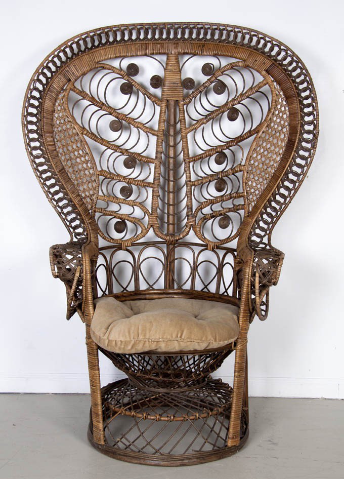 A Victorian Rattan Chair, Height 55 inches.: A Victorian Rattan Chair, having a balloon back and scrolling decoration throughout, over a circular base. Height 55 inches.