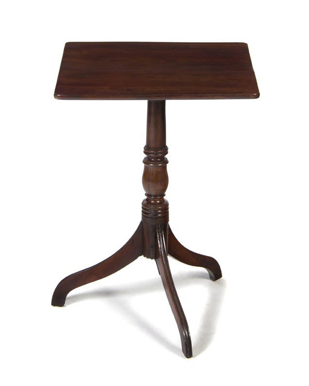 A Mahogany Candlestand, Height 27 inches.: A Mahogany Candlestand, having square top raised on a turned standard supported by a tripod base. Height 27 inches. Property from the Estate of Dr. Joseph and Donna Lee Boggs, Chicago, Illinois