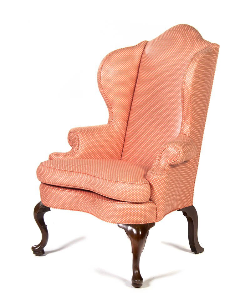 A Georgian Style Upholstered Wingback Armchair, He: A Georgian Style Upholstered Wingback Armchair, raised on cabriole legs ending in pad feet. Height 45 inches. Property from the Estate of Dr. Joseph and Donna Lee Boggs, Chicago, Illinois